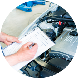 Person holding a clipboard evaluating a car