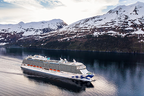 Princess Love Boat Sale a cruise boat sails down river through snowy mountains