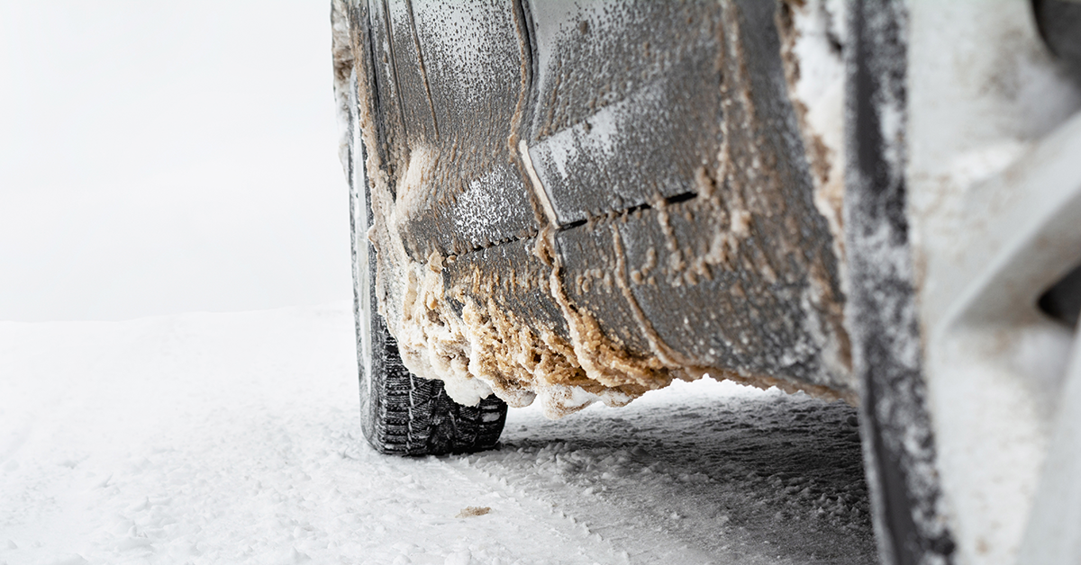 De-icing product and snow on a car exterior