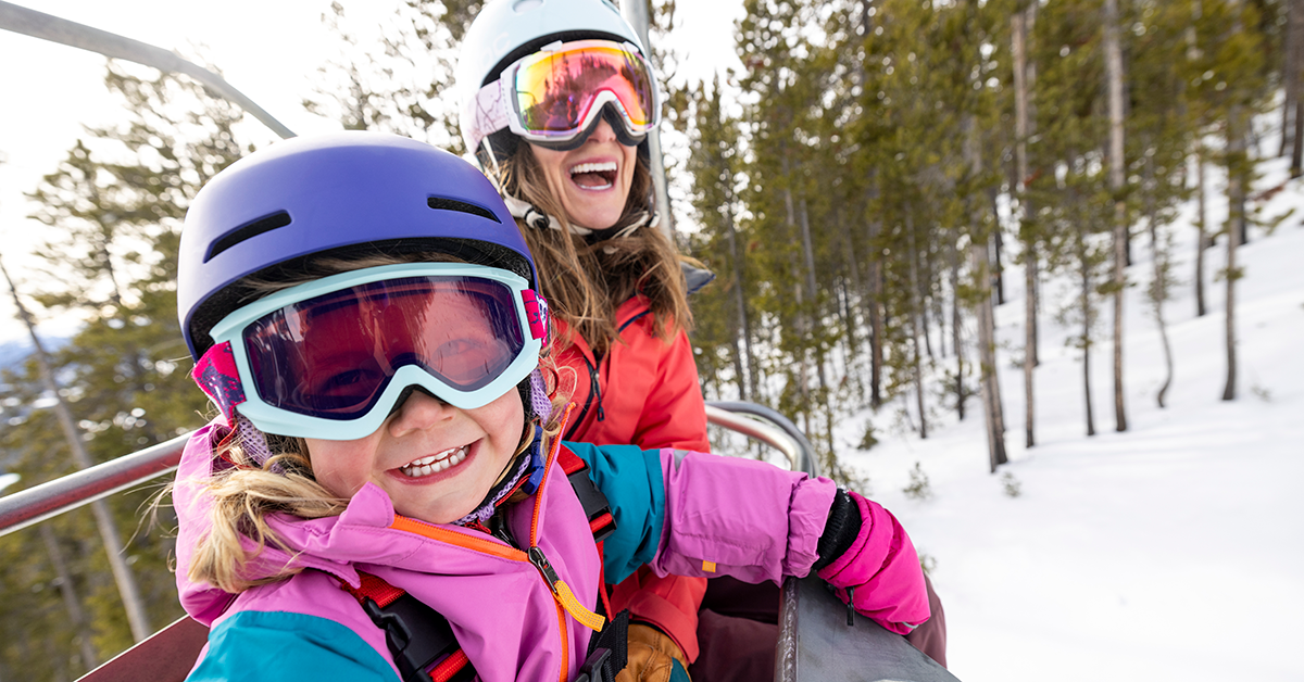 mother and daughter on ski lift