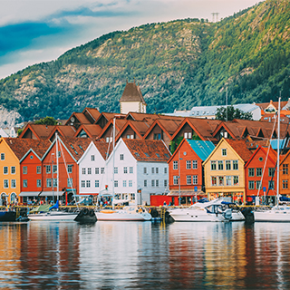 view of houses and mountains from river