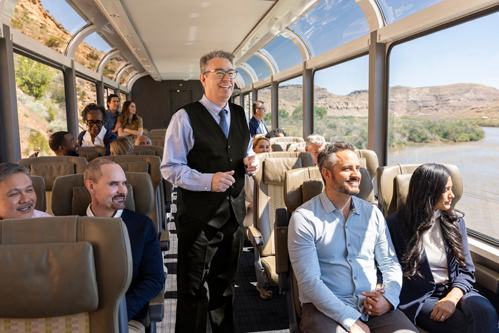 View of the inside of a Canyon Spirit rail train cart. Windows on all sides offer a panoramic view of the landscape.