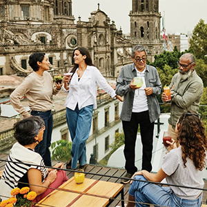 A group of friends enjoying drinks on a rooftop