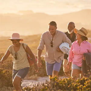 group of travelers hiking during golden hour