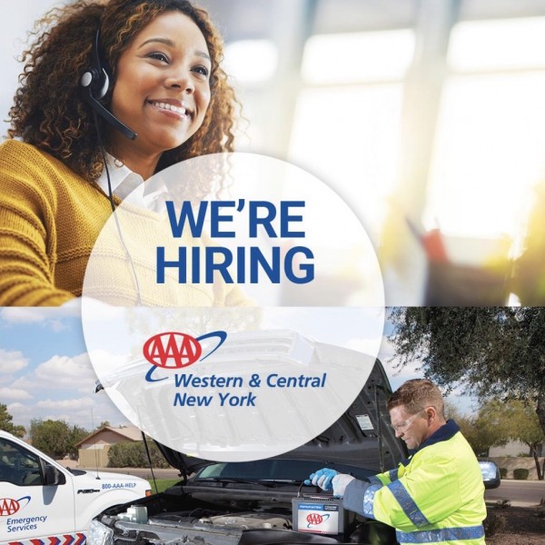Image of a customer service rep on the phone and a tow technician looking at the hood of a vehicle 